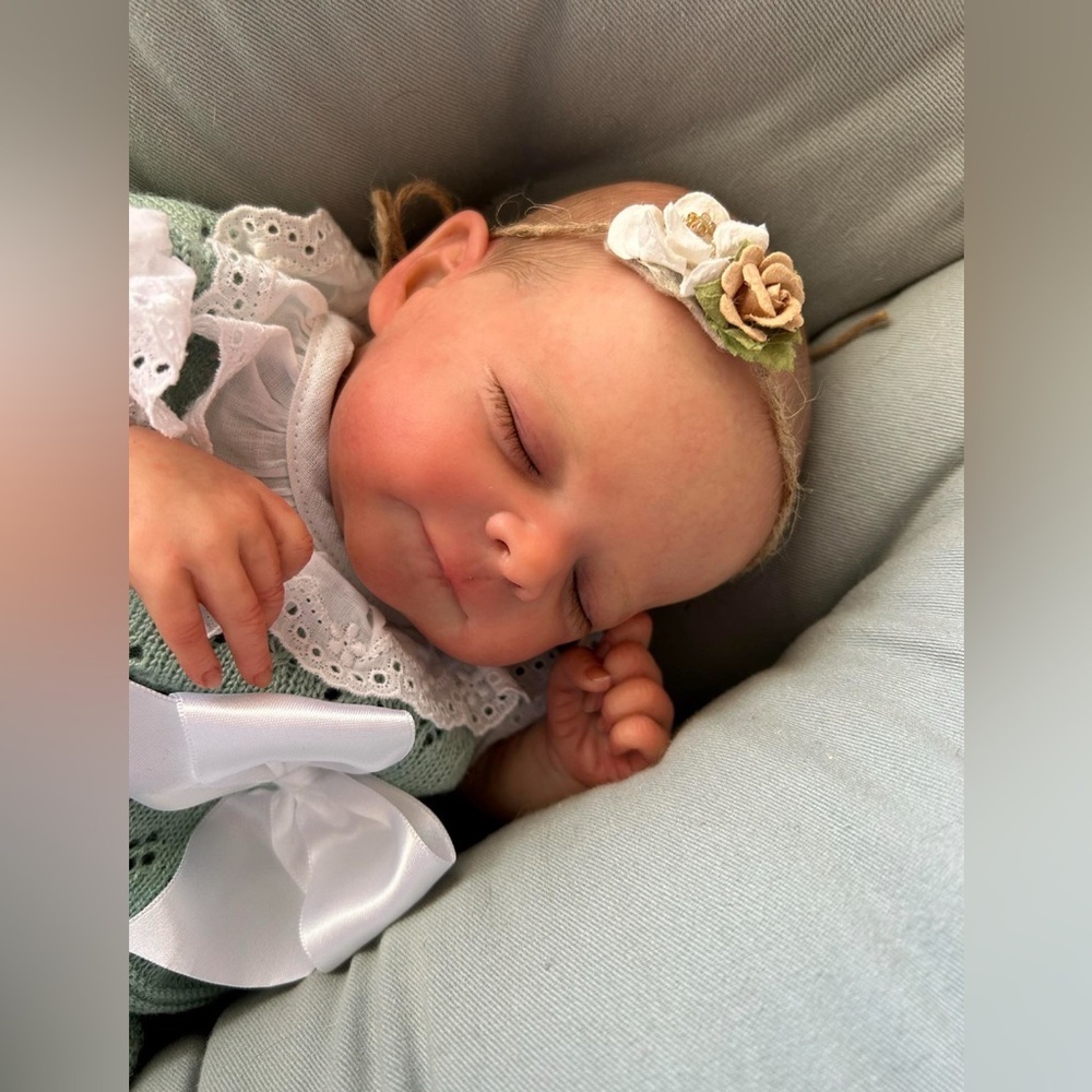 Reborn baby doll - realistic, painted with appropriate mottling of newborn